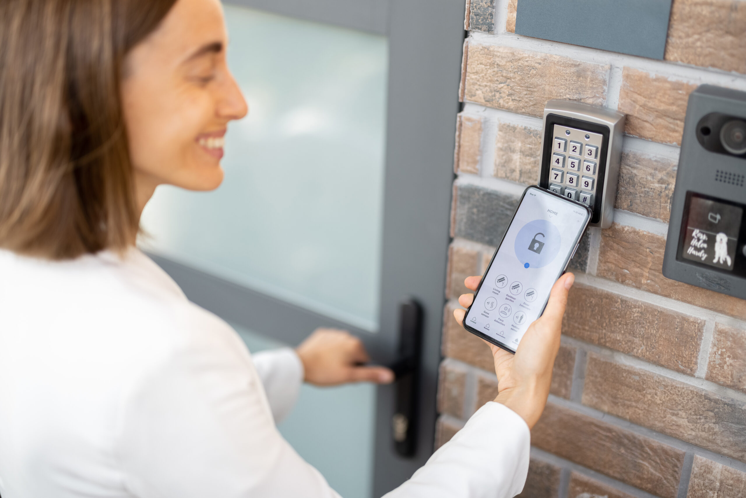 Opening door with a smart phone and keyboard on the wall